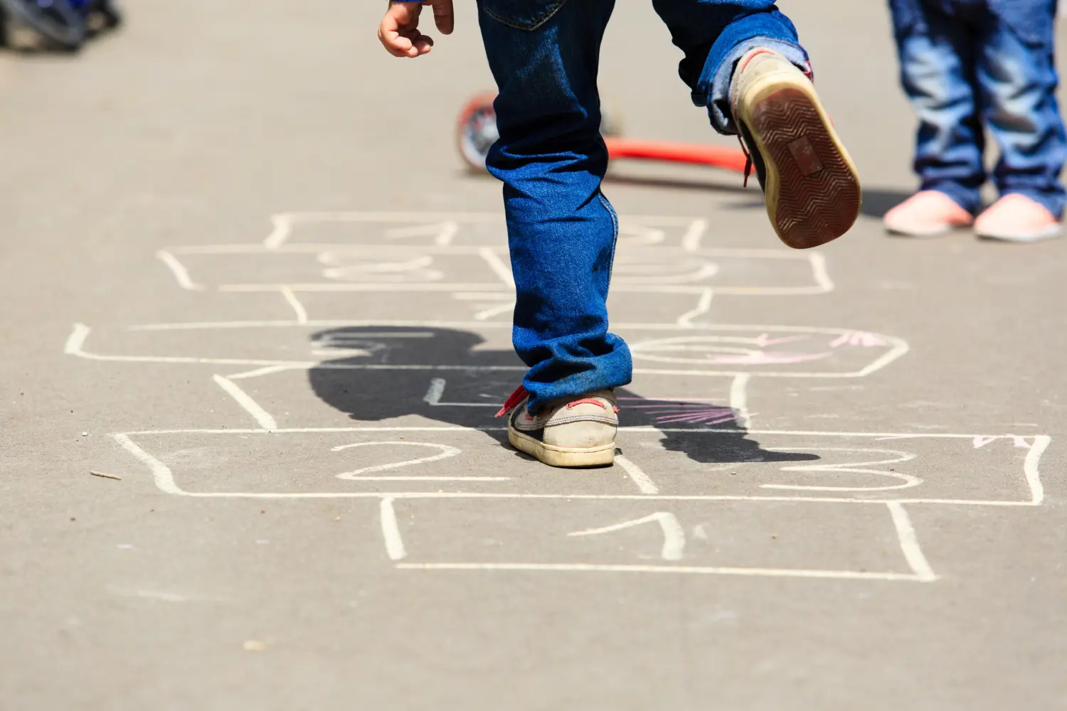 A child playing hopscotch