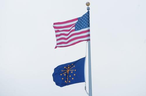 An American and State of Indiana flag fly Friday, Dec. 23, 2022, during a frigidly cold day in Central Indiana.