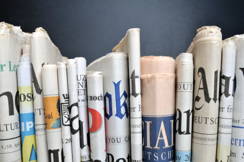 newspapers on a shelf