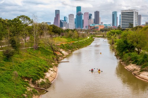 Houston, TX - March 09, 2019: Kayakers participate in the 47th Annual Buffalo Bayou Partnership Regatta on Buffalo Bayou Houston.