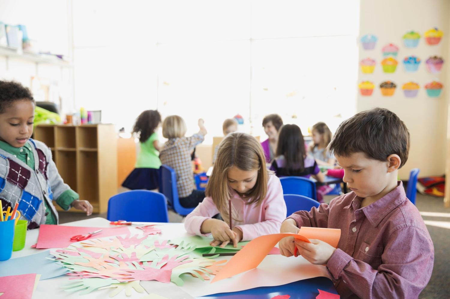 Elementary students tracing hands in class