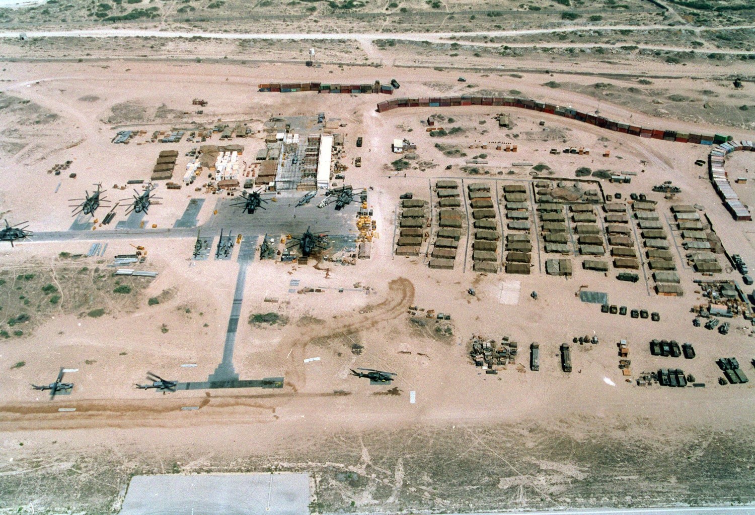 Base of the U.N. mostly U.S. Marine Forces in Somalia was built on an abandoned Soviet airfield in Mogadishu. Had a wall of shipping containers upper right to thwart random sniper fire. Feb. 25 1993.