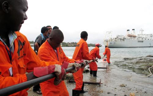 Contractors lay the East African Marine Cable (TEAMS) fiber optic cable from the ship Niwa outside the Portuguese built Fort Jesus in the Kenyan coastal city of Mombasa, June 12, 2009. The cable has taken 18 months to reach the Kenyan Coast by sea from the Middle East and is set to improve information and communication technology in Africa. REUTERS/Joseph Okanga (KENYA BUSINESS)