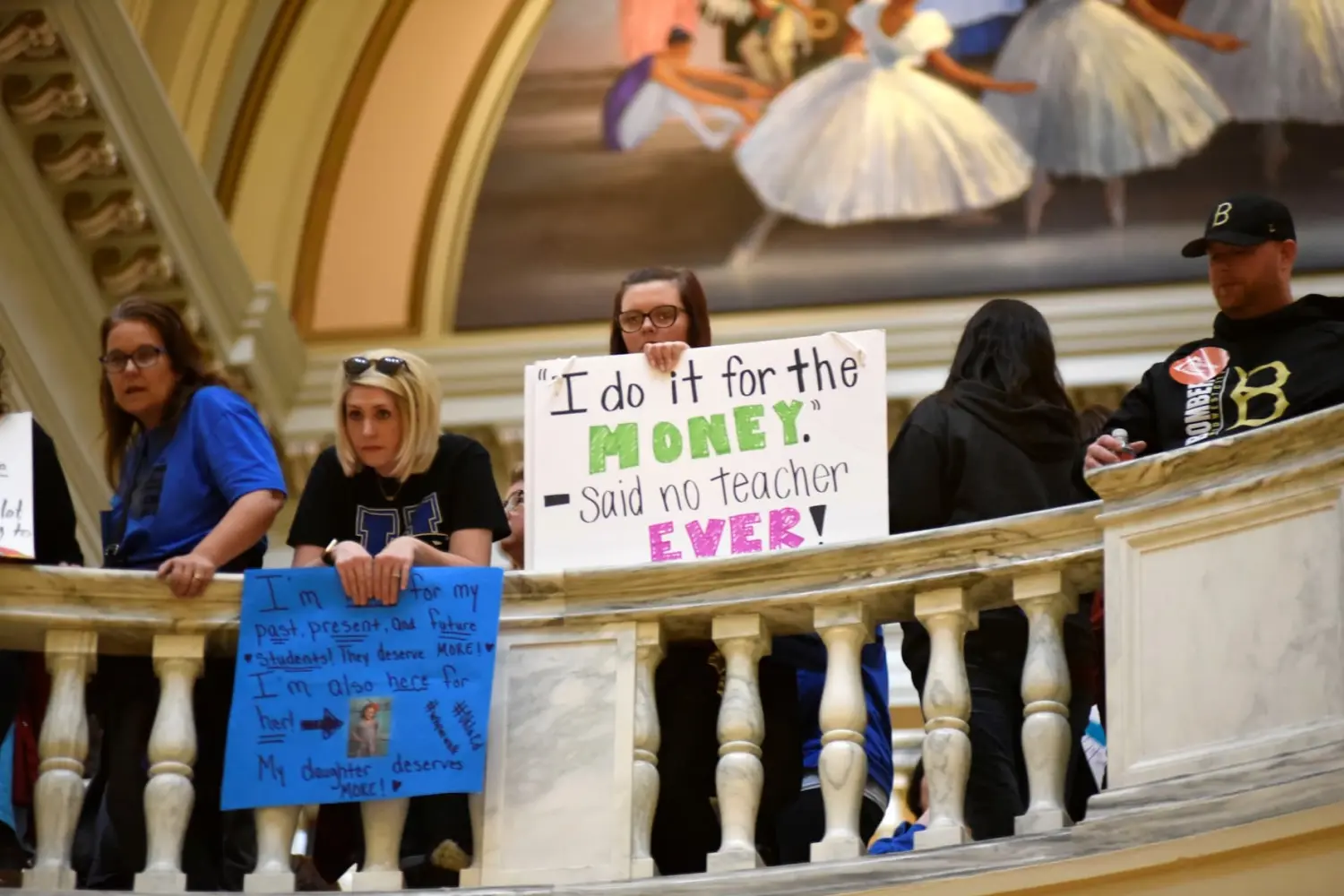 Teachers rally inside the state Capitol on the second day of a teacher walkout to demand higher pay and more funding for education in Oklahoma City, Oklahoma, U.S., April 3, 2018. REUTERS/Nick Oxford