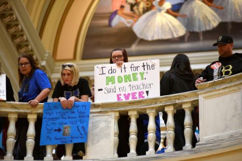 Teachers rally inside the state Capitol on the second day of a teacher walkout to demand higher pay and more funding for education in Oklahoma City, Oklahoma, U.S., April 3, 2018.  REUTERS/Nick Oxford