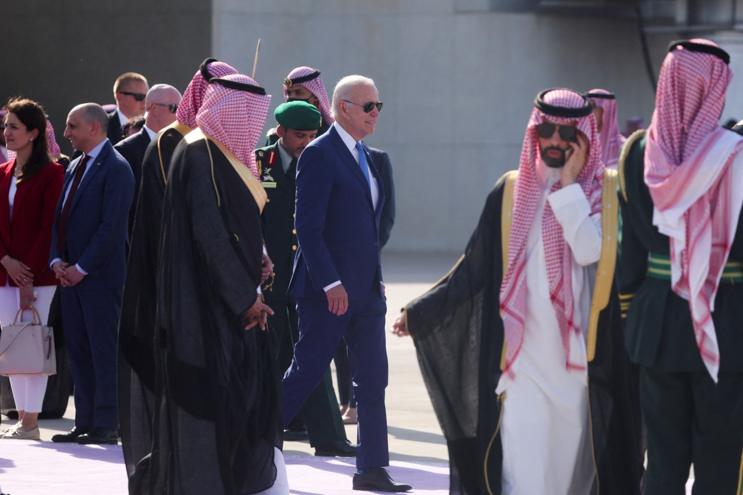 U.S. President Joe Biden walks to board a plane following an Arab summit, at King Abdulaziz International Airprot, in Jeddah, Saudi Arabia, July 16, 2022. REUTERS/Evelyn Hockstein