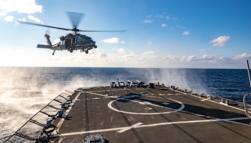 Handout photo dated January 26, 2023 shows Air Force 33rd Search and Rescue Squadron prepares to land aboard Arleigh Burke-class guided-missile destroyer USS Benfold (DDG 65) in the Philippine Sea. The United States and the Philippines on Thursday announced plans to expand America's military presence in the Southeast Asian nation, with access to four more bases as they seek to deter China’s increasingly aggressive actions toward Taiwan and in the disputed South China Sea. The agreement was reached as US Defense Secretary Lloyd Austin was in the country for talks about deploying US forces and weapons in more Philippine military camps. U.S. Navy photo by Mass Communication Specialist 3rd Class RuKiyah Mack via ABACAPRESS.COM