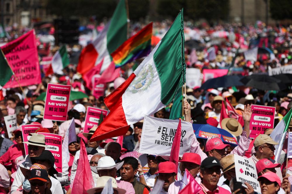 People take part in a protest in support of the National Electoral Institute (INE) and against President Andres Manuel Lopez Obrador's plan to reform the electoral authority, in Mexico City, Mexico, February 26, 2023. REUTERS/Luis Cortes