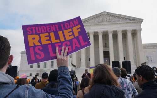 Feb 28, 2023; Washington, DC, USA; Protestors gather outside the U.S. Supreme Court ahead of the oral arguments in two cases that challenge President Joe Biden's $400 billion student loan forgiveness plan.. Mandatory Credit: Megan Smith-USA TODAY