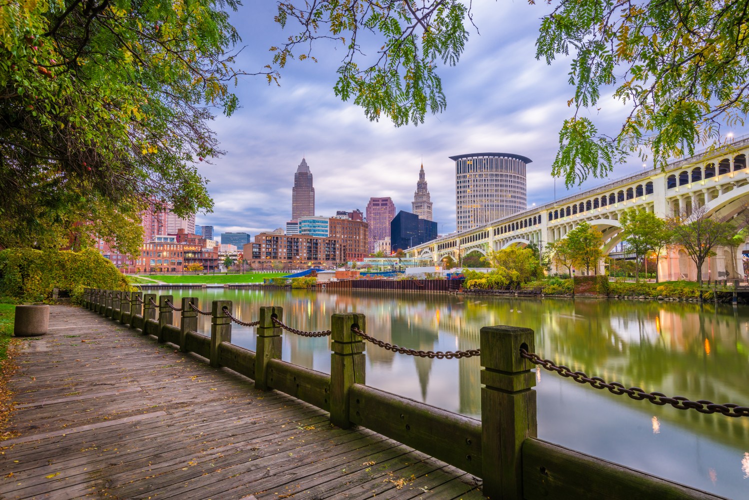 Cleveland, Ohio, USA downtown skyline on the Cuyahoga River at dusk.