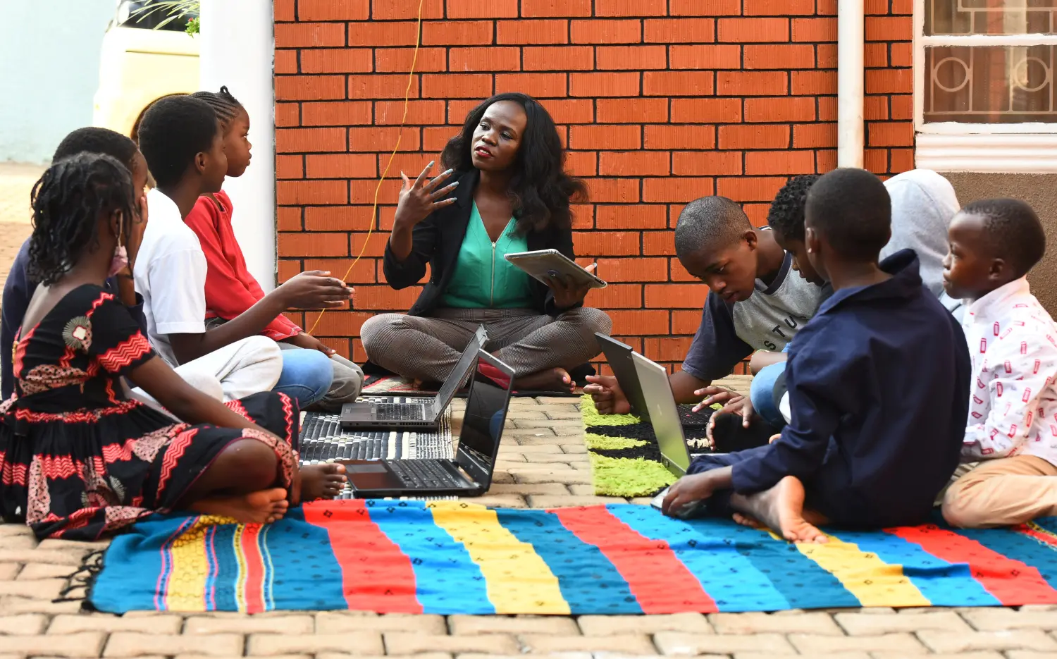 Shamim Mwanaisha, a travel consultant and trainer, leads students in coding, aviation, space and climate change during a tutorial session at her home in Kitintale suburb of Kampala, Uganda August 28, 2021. Picture taken August 28, 2021. REUTERS/Abubaker Lubowa