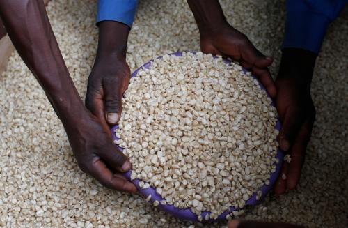 A Malawian trader sells maize near the capital Lilongwe, Malawi February 1, 2016. Late rains in Malawi threaten the staple maize crop and have pushed prices to record highs. About 14 million people face hunger in Southern Africa because of a drought that has been exacerbated by an El Nino weather pattern, according to the United Nations World Food Programme (WFP). REUTERS/Mike Hutchings