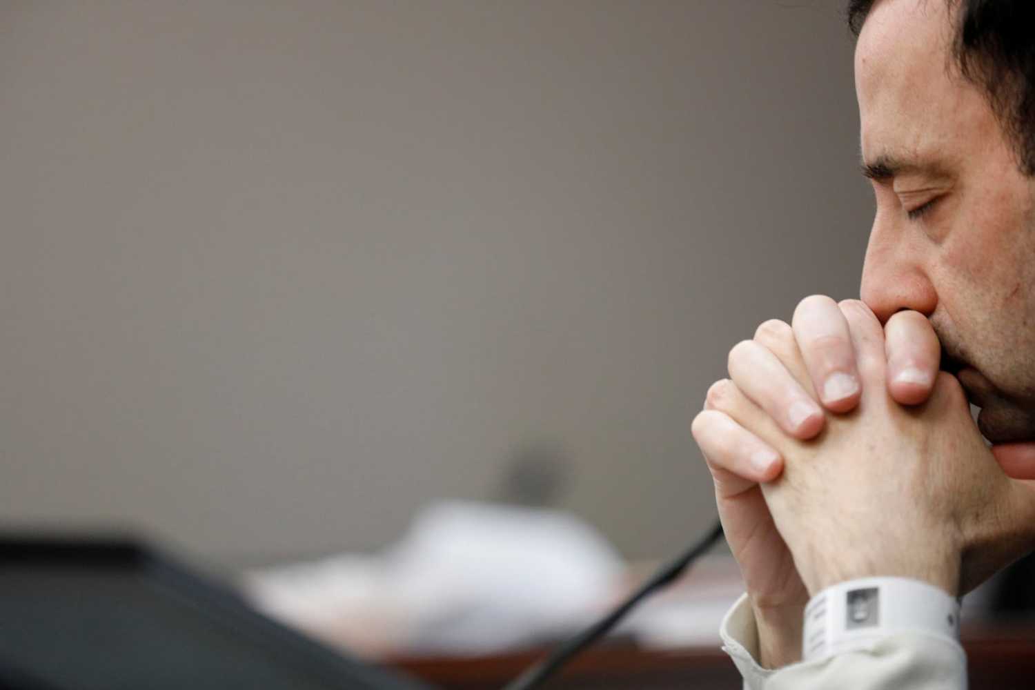 Dr. Larry Nassar, a former team USA Gymnastics doctor who pleaded guilty in November 2017 to sexual assault charges, listens to a victim during his sentencing hearing in Lansing, Michigan, U.S., January 16, 2018. REUTERS/Brendan McDermid