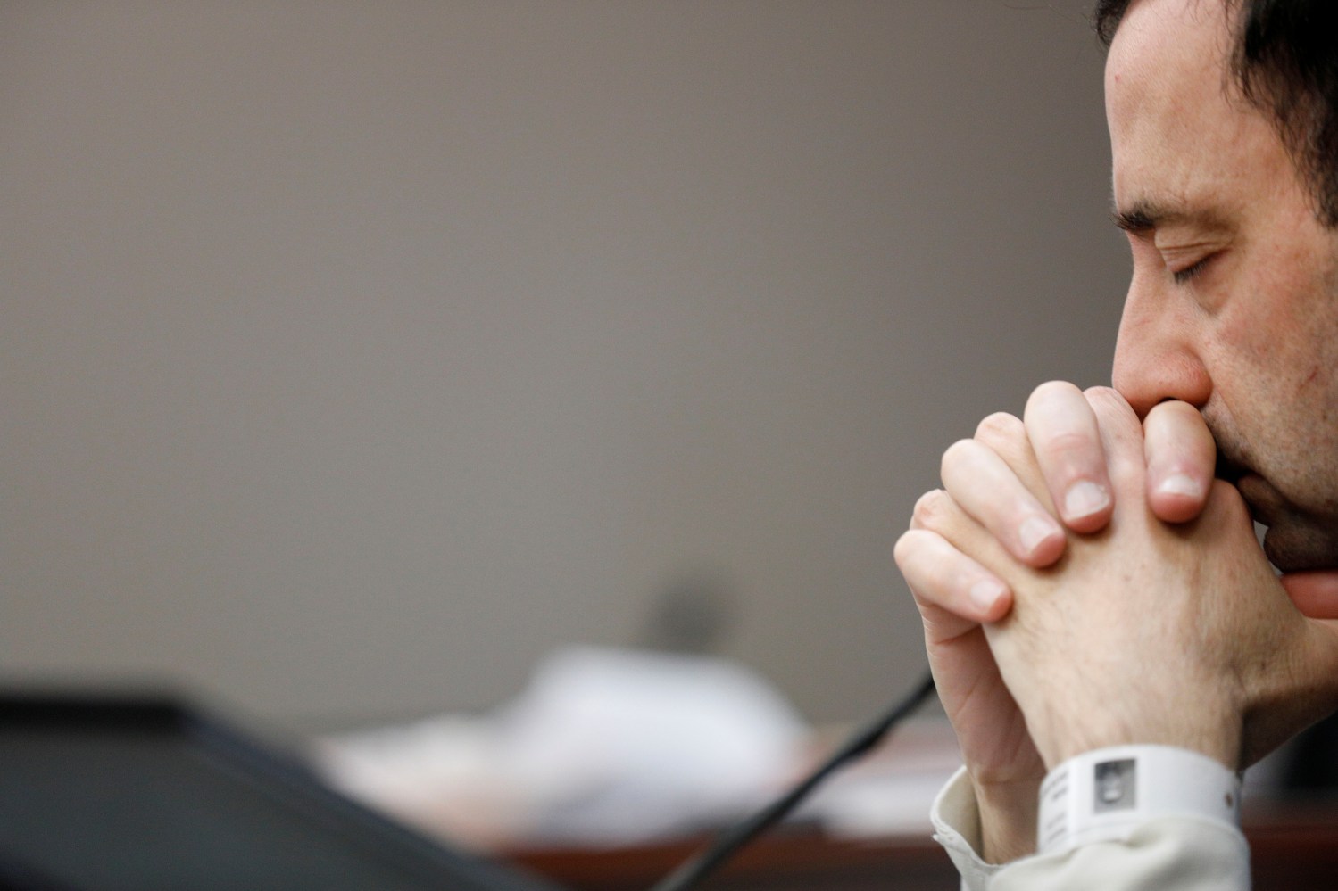 Dr. Larry Nassar, a former team USA Gymnastics doctor who pleaded guilty in November 2017 to sexual assault charges, listens to a victim during his sentencing hearing in Lansing, Michigan, U.S., January 16, 2018.    REUTERS/Brendan McDermid