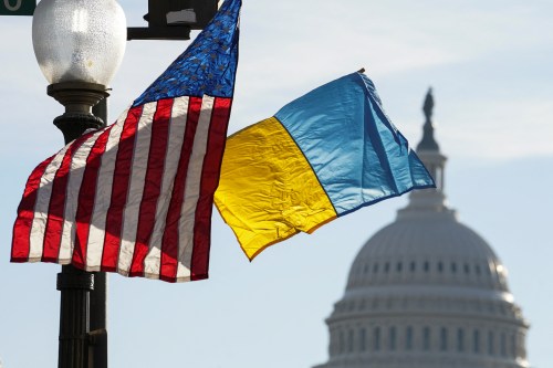 Ukrainian and U.S. flags are flown along Pennsylvania Avenue leading to the U.S. Capitol ahead of a visit by Ukraine's President Volodymyr Zelenskiy for talks with U.S. President Joe Biden and an address to a joint meeting of Congress in Washington, U.S., December 21, 2022. REUTERS/Kevin Lamarque