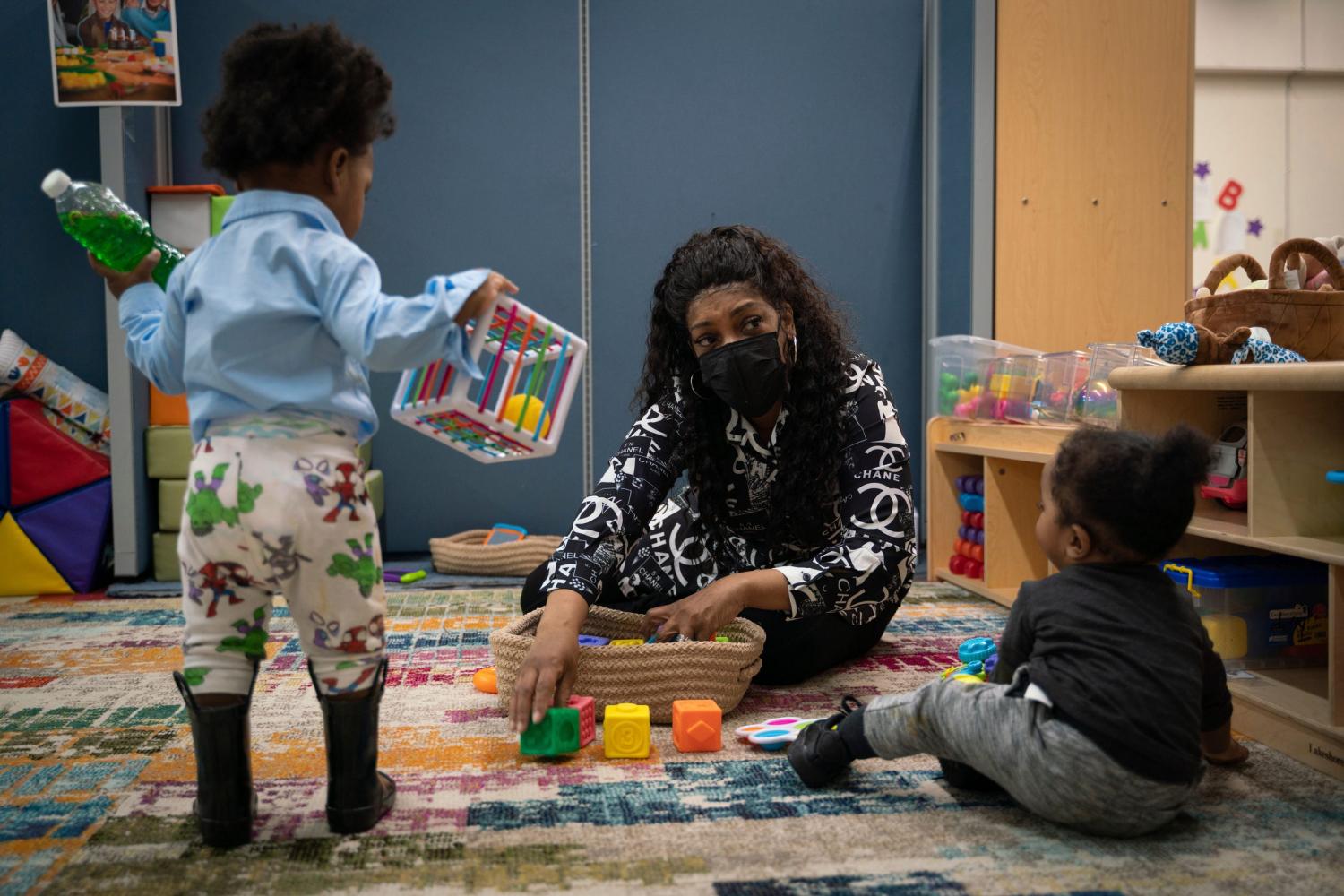 Co-owner Jacqueline Fordham, 59, center, plays with Corron O., 1, and 11-month-old Brandon H., at Cribs2College Academy child care center in Detroit on April 5, 2023.Preschool Mental Health3 1