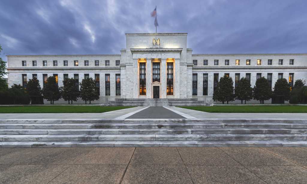 Front of the Federal Reserve Bank building at dusk