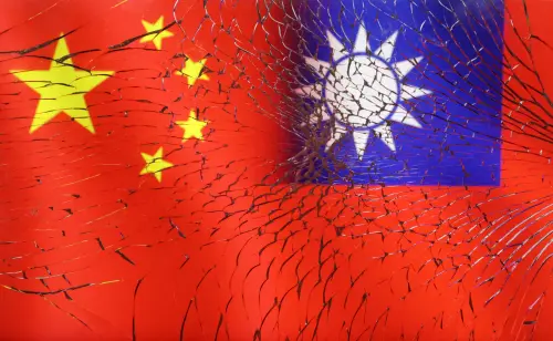 Chinese and Taiwanese flags are seen through broken glass in this illustration taken, April 11, 2023. REUTERS/Dado Ruvic/Illustration