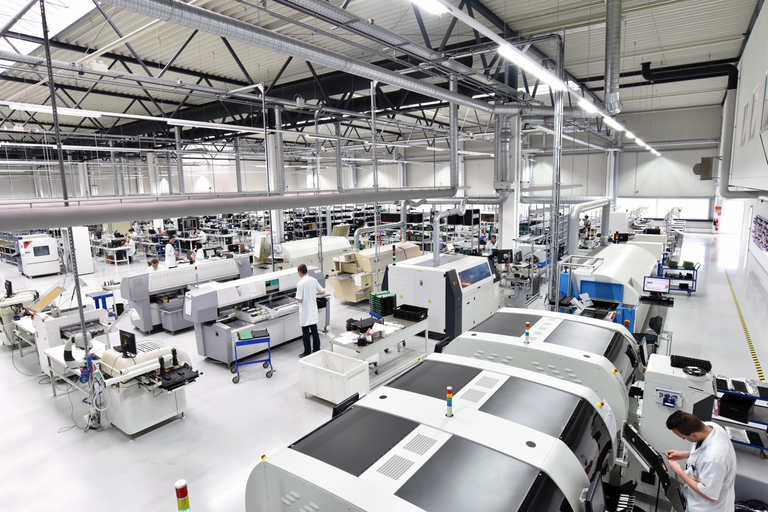 modern industrial factory for the production of electronic components - machinery, interior and equipment of the production hall. Photo: Shutterstock