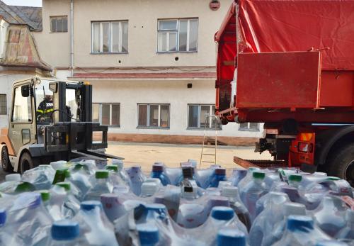 Ostrava, Czech republic - march 17 2022: Firefighters load pallets with humanitarian aid for Ukraine, which people handed over in a public charity