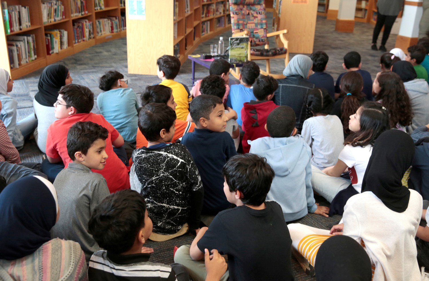 Students at Miller Elementary School sit and wait in the library for a visit from Senator Kamala Harris in Dearborn, Michigan, U.S. May 6, 2019.  REUTERS/Rebecca Cook