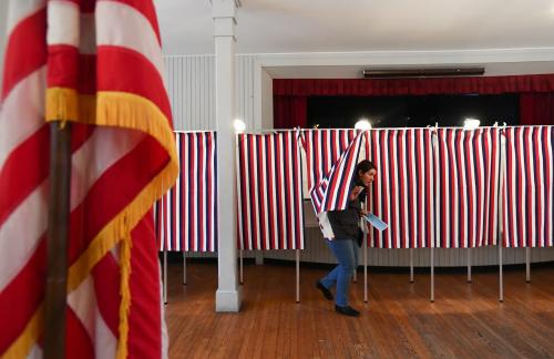 FILE PHOTO: A voter leaves a voting booth after casting her ballot in the state's presidential primary election in Greenfield, New Hampshire, U.S. February 11, 2020. REUTERS/Gretchen Ertl/File Photo
