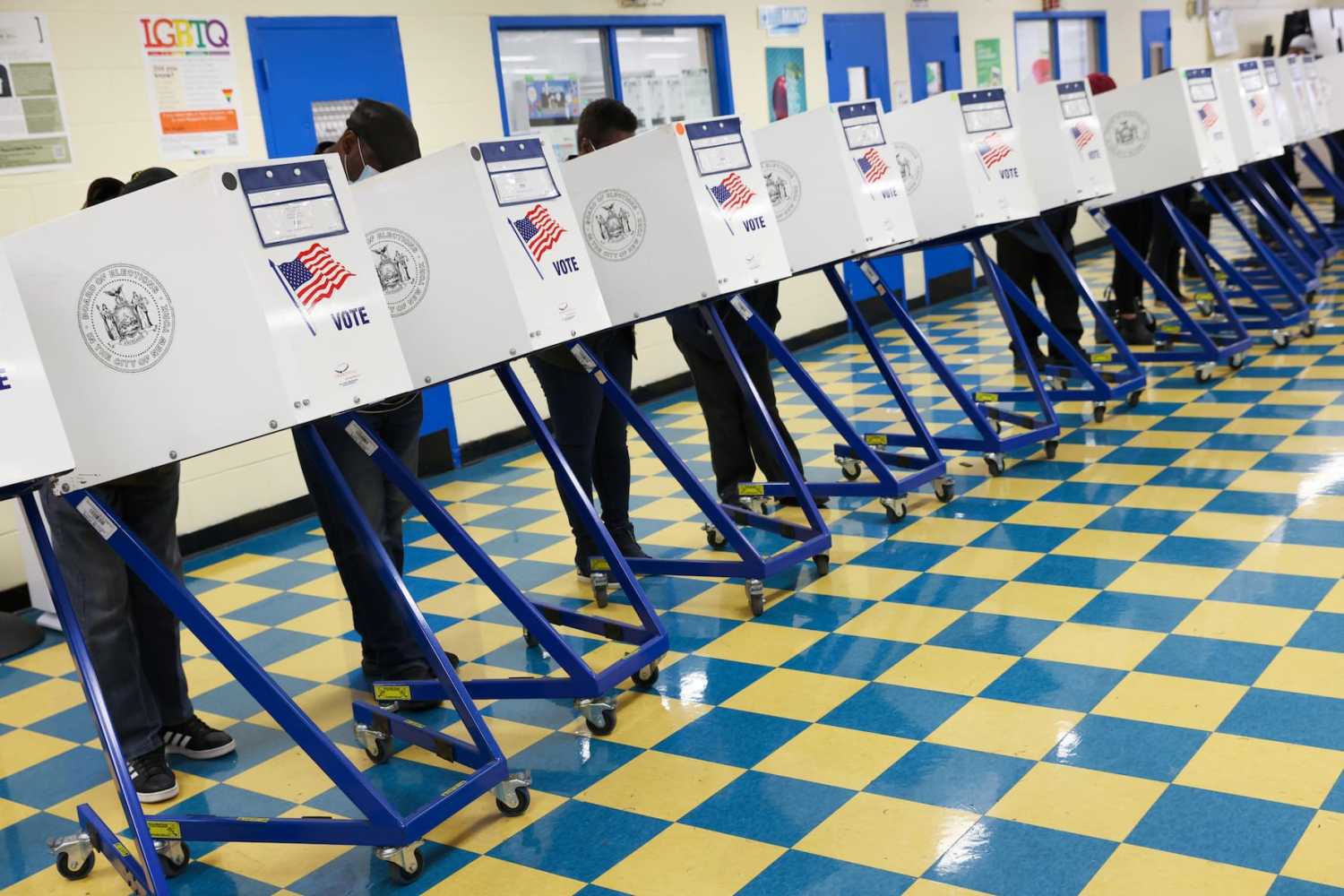 People fill ballots in privacy booths at a polling station at the Jackie Robinson School during the New York City mayoral election in Brooklyn, New York, U.S., November 2, 2021.