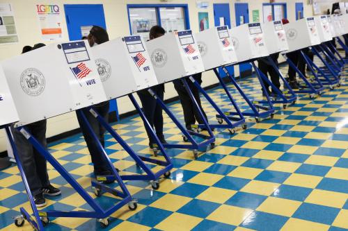 People fill ballots in privacy booths at a polling station at the Jackie Robinson School during the New York City mayoral election in Brooklyn, New York, U.S., November 2, 2021.