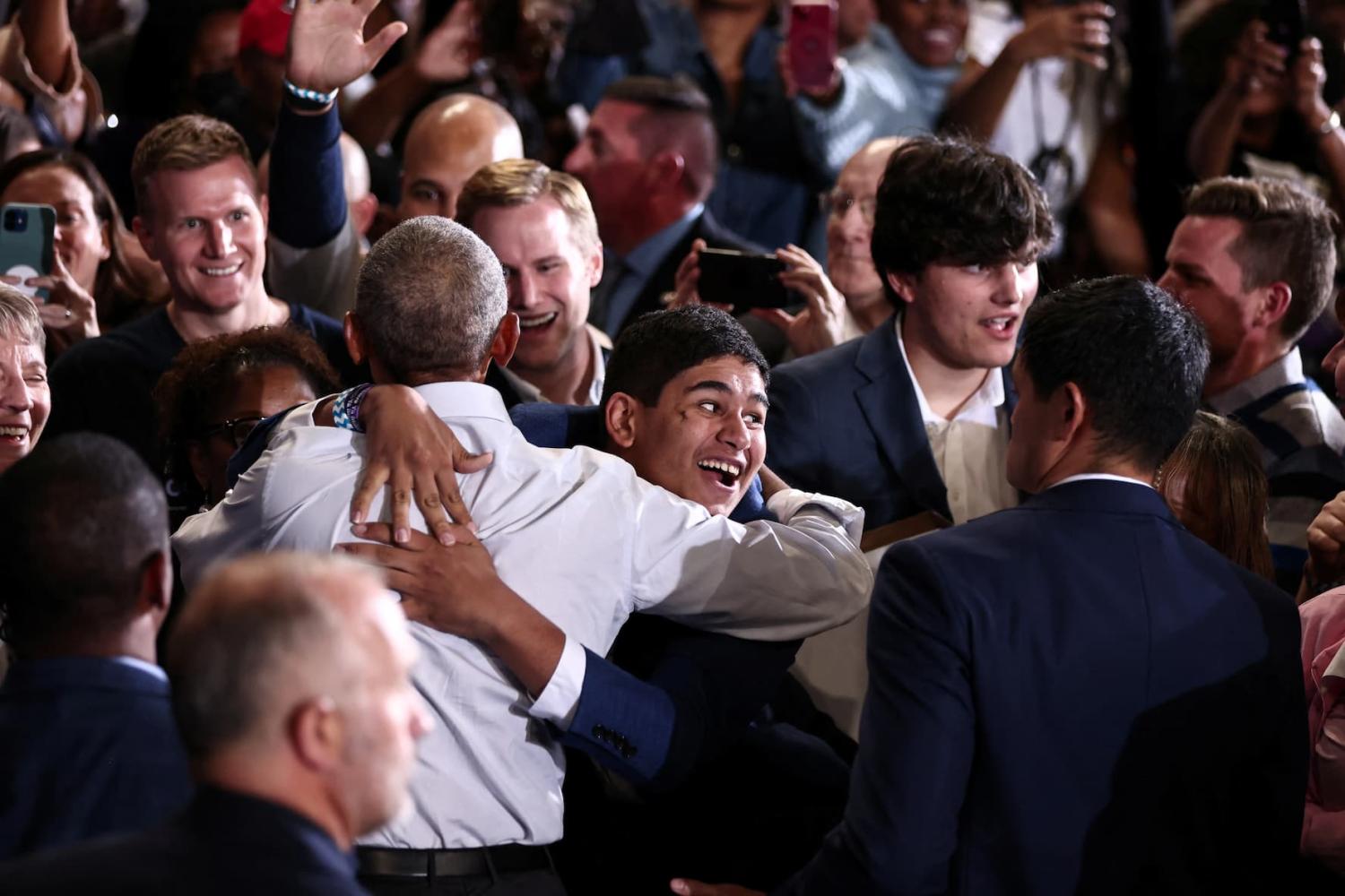 Former U.S. president Barack Obama greets people at a campaign rally for Senator Raphael Warnock ahead of the midterm elections in Atlanta, Georgia, U.S., October 28, 2022. REUTERS/Dustin Chambers