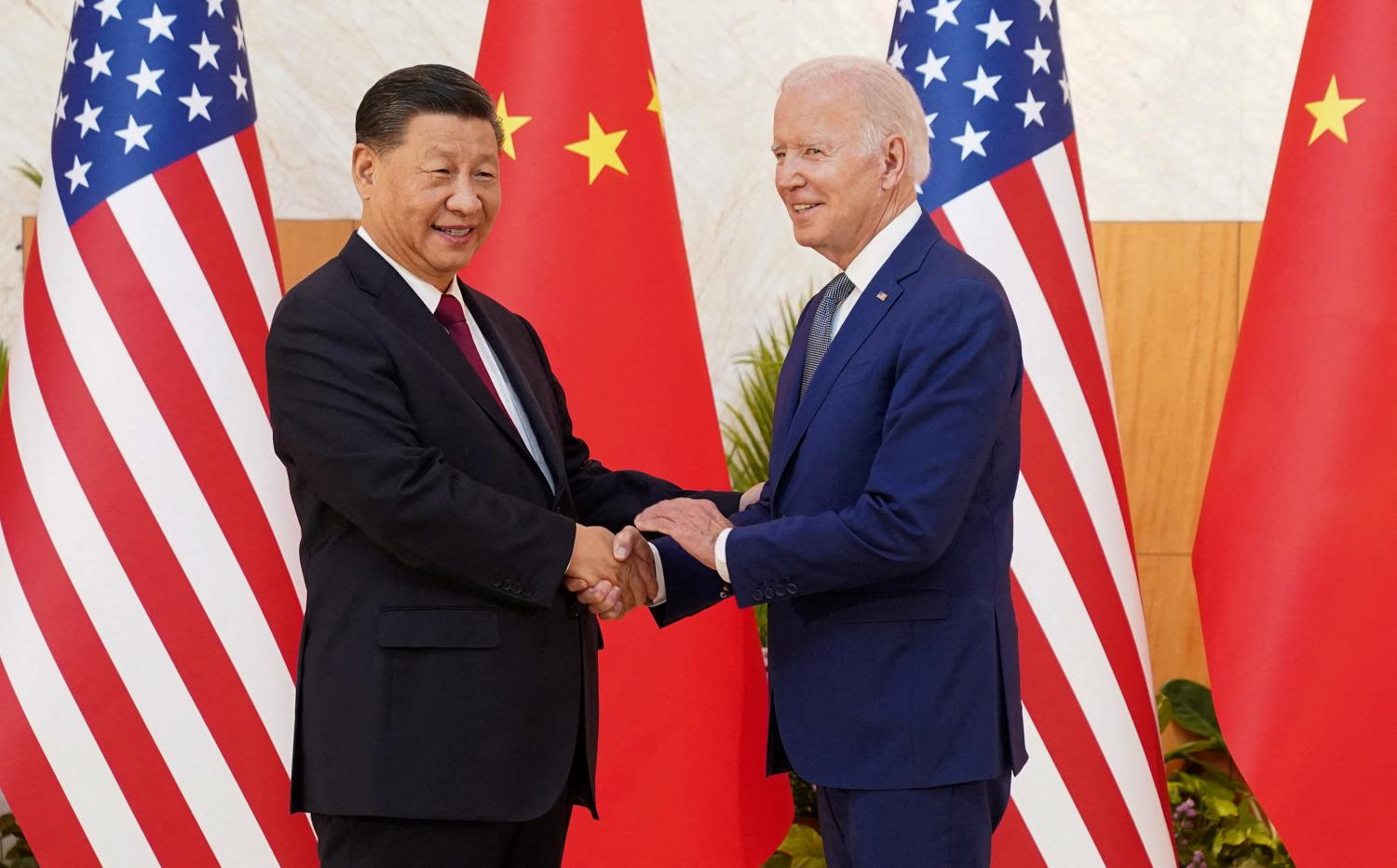 U.S. President Joe Biden shakes hands with Chinese President Xi Jinping as they meet on the sidelines of the G20 leaders' summit in Bali, Indonesia, November 14, 2022.  REUTERS/Kevin Lamarque