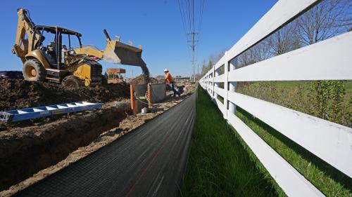 April 13, 2023; New Albany, Ohio, USA; Workers lay fiber optic cable piping as the St. Rt. 161 and Rt. 62 interchange is expanded in New Albany near the new Intel chip manufacturing plant.  Mandatory Credit: Doral Chenoweth-The Columbus DispatchLEAD PHOTO 01 161 Expansion