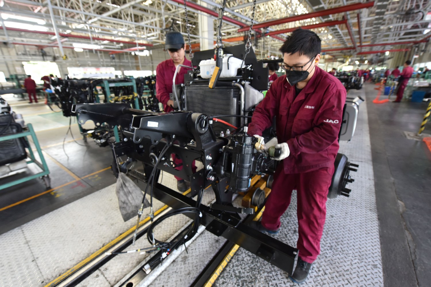 FUYANG, CHINA - APRIL 17, 2023 - Workers work on the production line of a truck assembly workshop at the Fuyang branch of JAC Motors Group Co LTD in east China's Anhui Province. (CFOTO/Sipa USA)