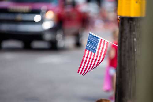 American flag in front of rural street
