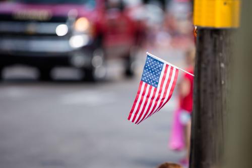 American flag in front of rural street