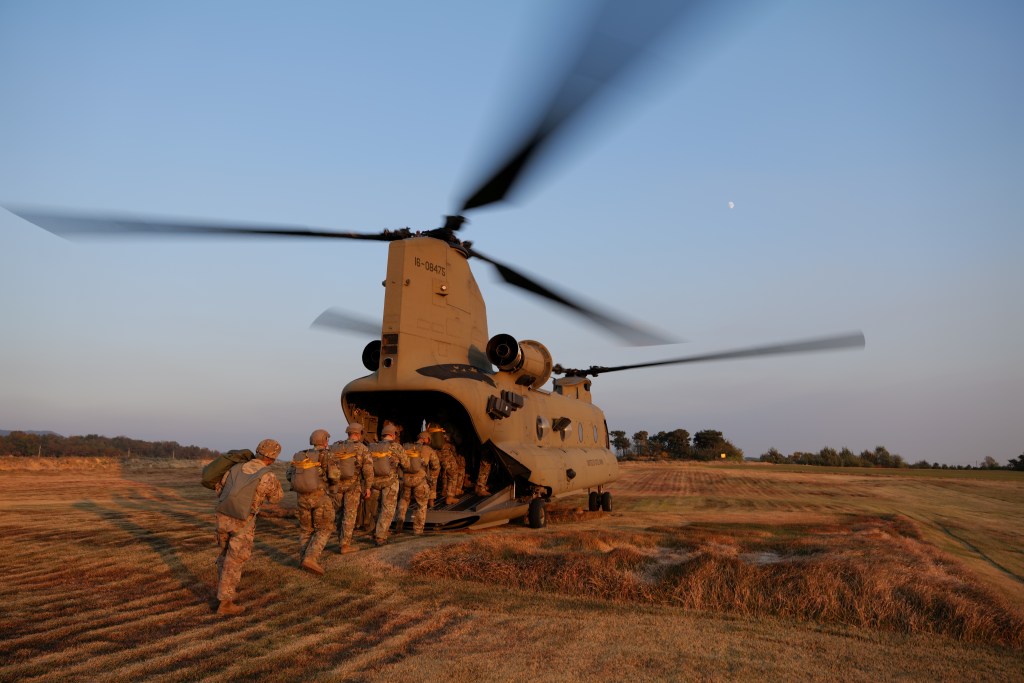 Members of South Korea and U.S. Special forces get on a CH-47 Chinook during a joint military exercise conducted by South Korean and U.S. special forces troops in Gangwon province, South Korea, November 7, 2019.  Photo taken November 7, 2019.  Capt. David J. Murphy/U.S. Air Force/DVIDS/Handout via REUTERS   ATTENTION EDITORS - THIS IMAGE WAS PROVIDED BY A THIRD PARTY