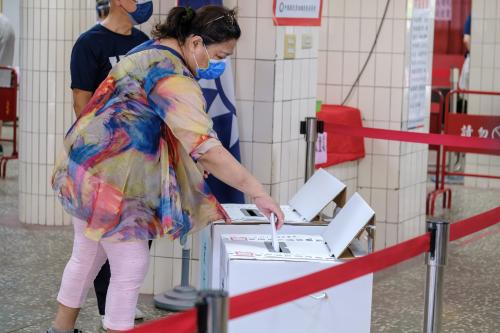 A member of the KMT (Kuomintang), Taiwan s main opposition party, casts her ballot during the election of the new chairperson at a polling station in New Taipei City. (Photo by Walid Berrazeg / SOPA Images/Sipa USA)No Use Germany.