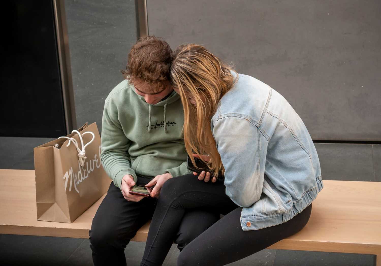 Teenagers look at phone