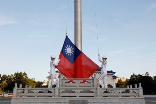 Honour guard members take part in a flag-raising ceremony at Chiang Kai-shek Memorial Hall in Taipei, Taiwan August 6, 2022. REUTERS/Jameson Wu