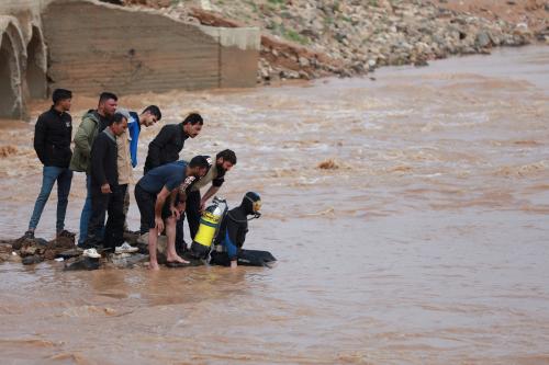 A member of the rescue team prepares to dive to search for missing people in a river, after heavy rainfall in Hasaka, Syria, March 18, 2023. REUTERS/Orhan Qereman