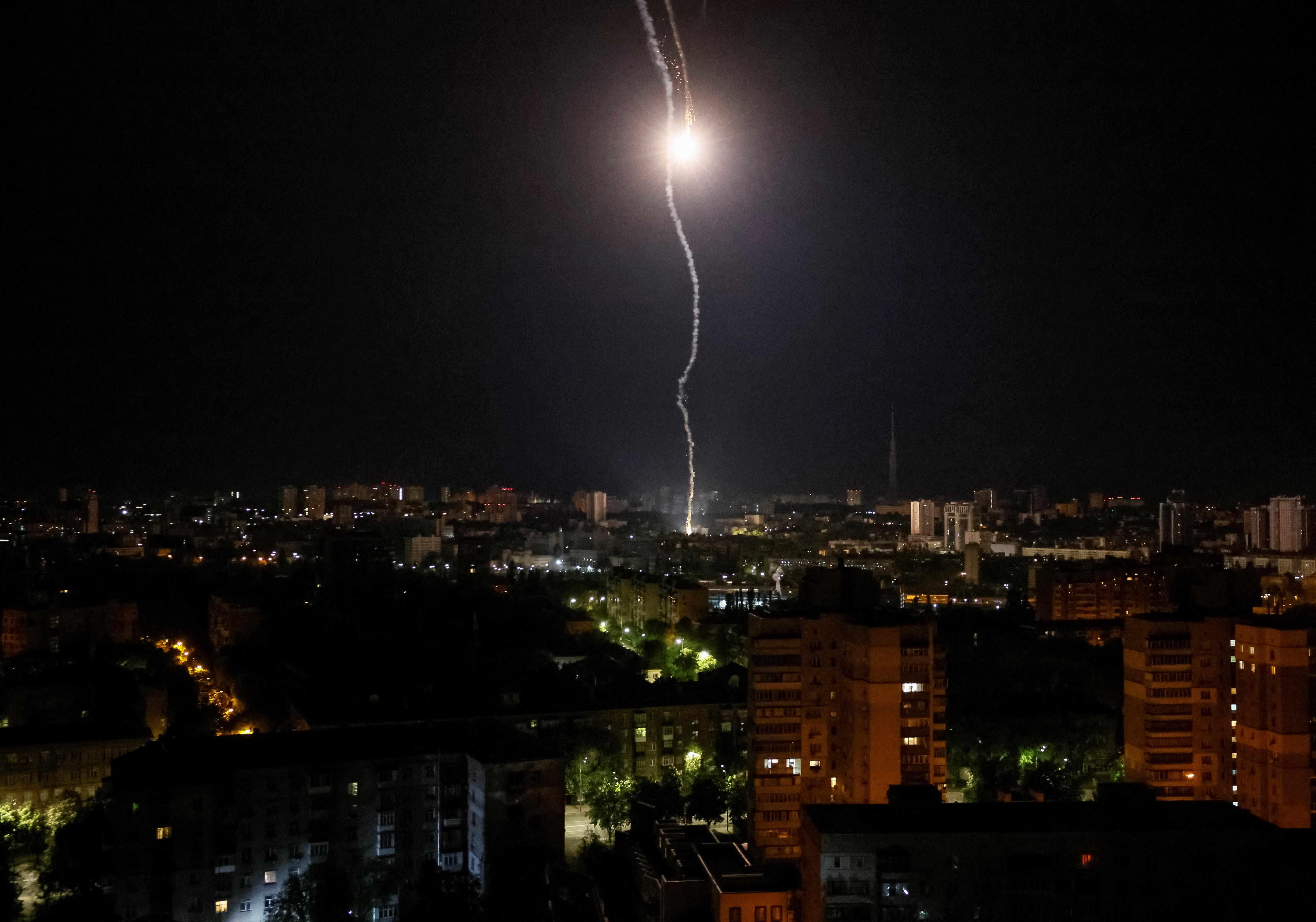 Explosion of a missile is seen in the sky over the city during a Russian missile strike, amid Russia's attack on Ukraine, in Kyiv, Ukraine May 16, 2023. REUTERS/Gleb Garanich