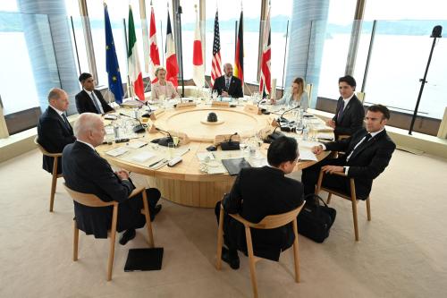 FILE PHOTO: U.S. President Joe Biden, Germany's Chancellor Olaf Scholz, Britain's Prime Minister Rishi Sunak, European Commission President Ursula von der Leyen, President of the European Council Charles Michel, Italy's Prime Minister Giorgia Meloni, Canada's Prime Minister Justin Trudeau, France's President Emmanuel Macron and Japan's Prime Minister Fumio Kishida attend a working lunch meeting at G7 leaders' summit in Hiroshima, western Japan May 19, 2023, in this handout photo released by Ministry of Foreign Affairs of Japan. Ministry of Foreign Affairs of Japan/HANDOUT via REUTERS ATTENTION EDITORS - THIS IMAGE WAS PROVIDED BY A THIRD PARTY.  MANDATORY CREDIT./File Photo