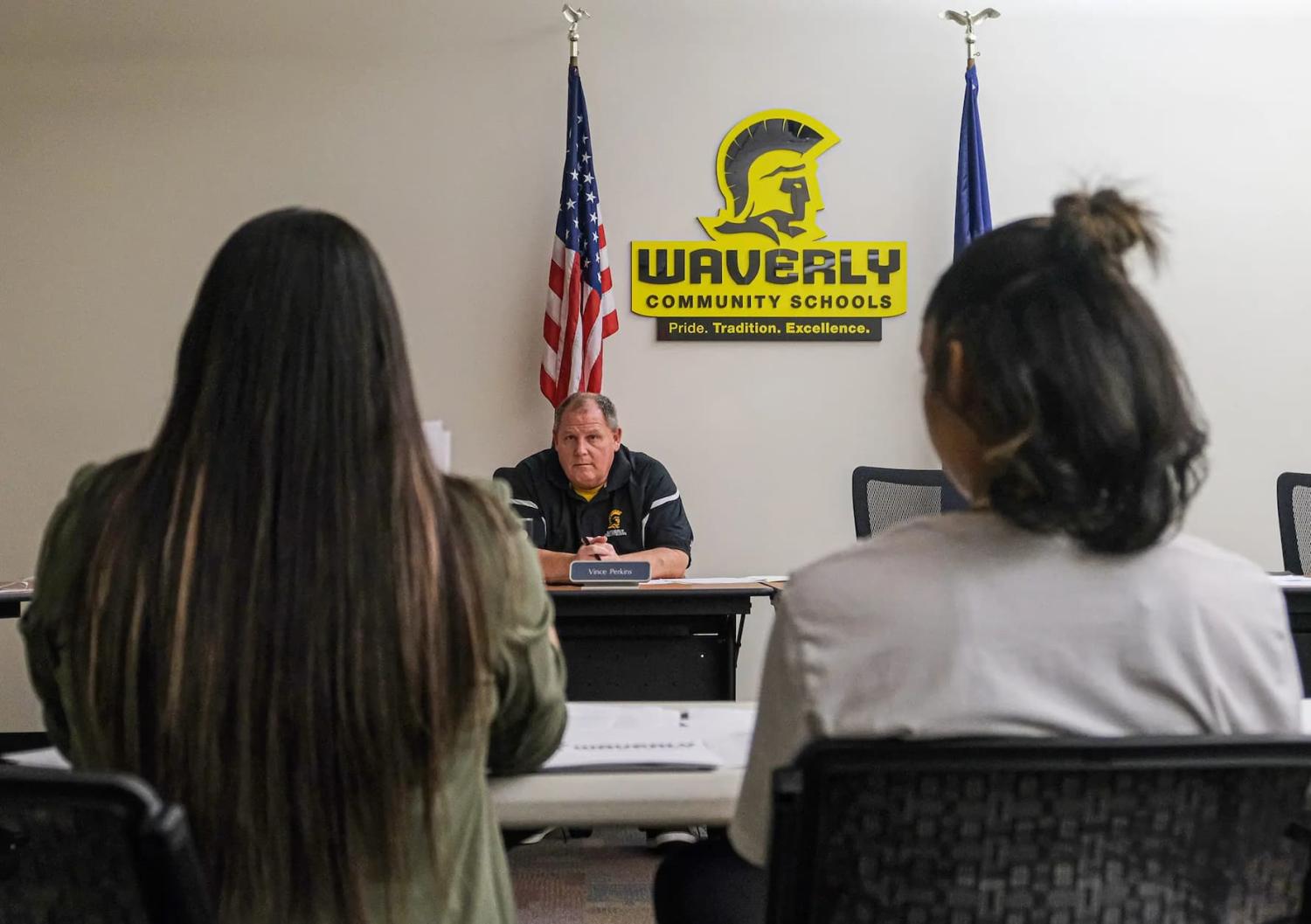 Paloma Sanchez, left, and her daughter Paloma, 13, listen to Waverly School Board Member Vince Perkins at a meeting that will determine the discipline action the board will take against the student Tuesday, May 23, 2023.
