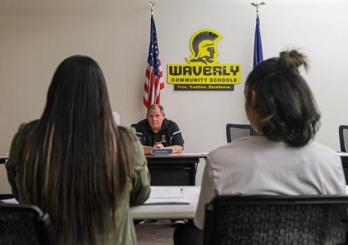 Paloma Sanchez, left, and her daughter Paloma, 13, listen to Waverly School Board Member Vince Perkins at a meeting that will determine the discipline action the board will take against the student Tuesday, May 23, 2023.