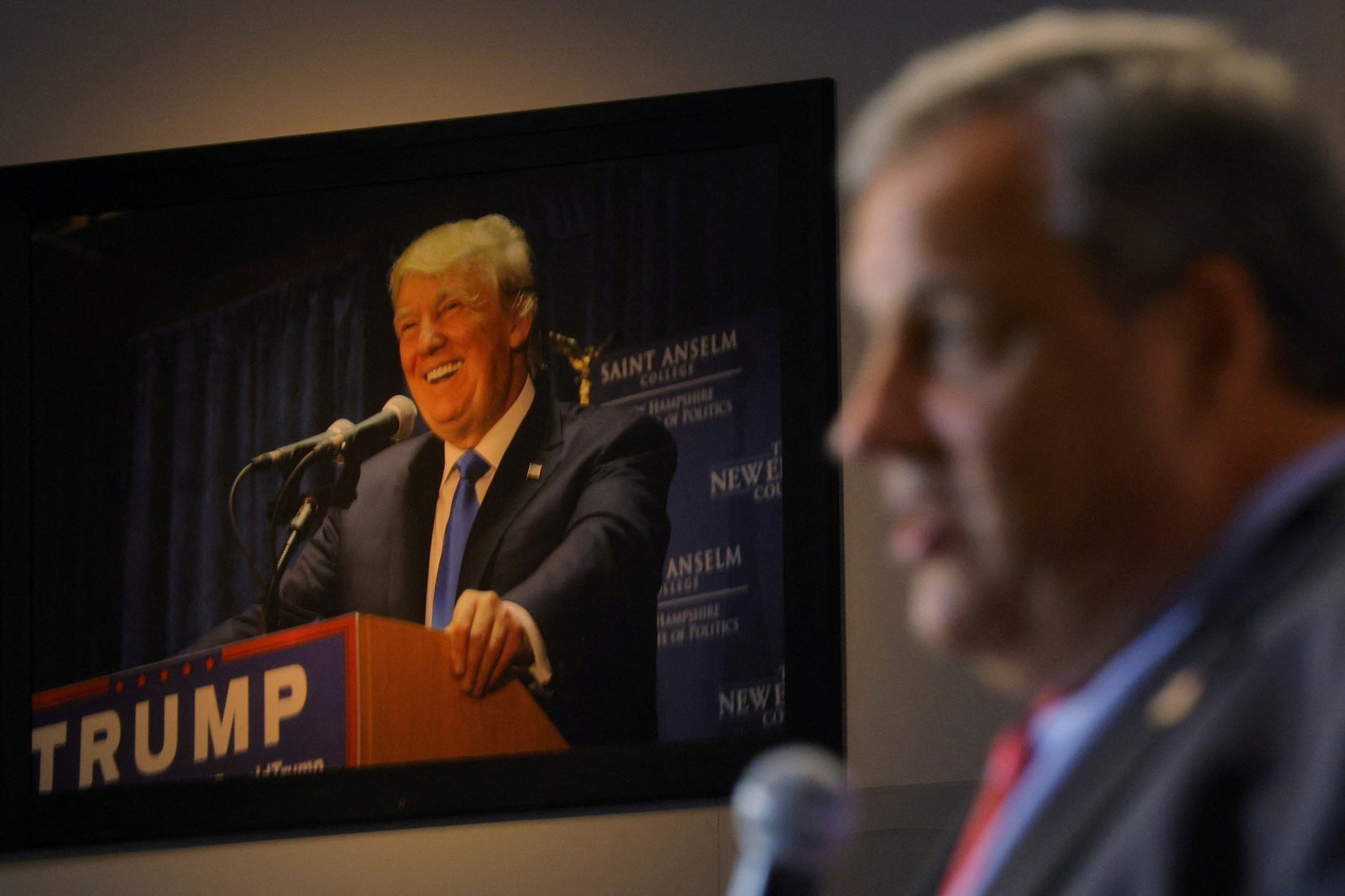 FILE PHOTO: A photograph of former U.S. President Donald Trump hangs on the wall as former New Jersey Governor Chris Christie speaks at the Institute of Politics at St. Anselm College in Manchester, New Hampshire, U.S., March 27, 2023.     REUTERS/Brian Snyder/File Photo