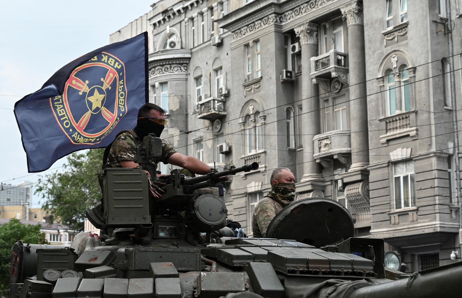 Fighters of Wagner private mercenary group are seen atop of a tank while being deployed near the headquarters of the Southern Military District in the city of Rostov-on-Don, Russia, June 24, 2023. REUTERS/Stringer