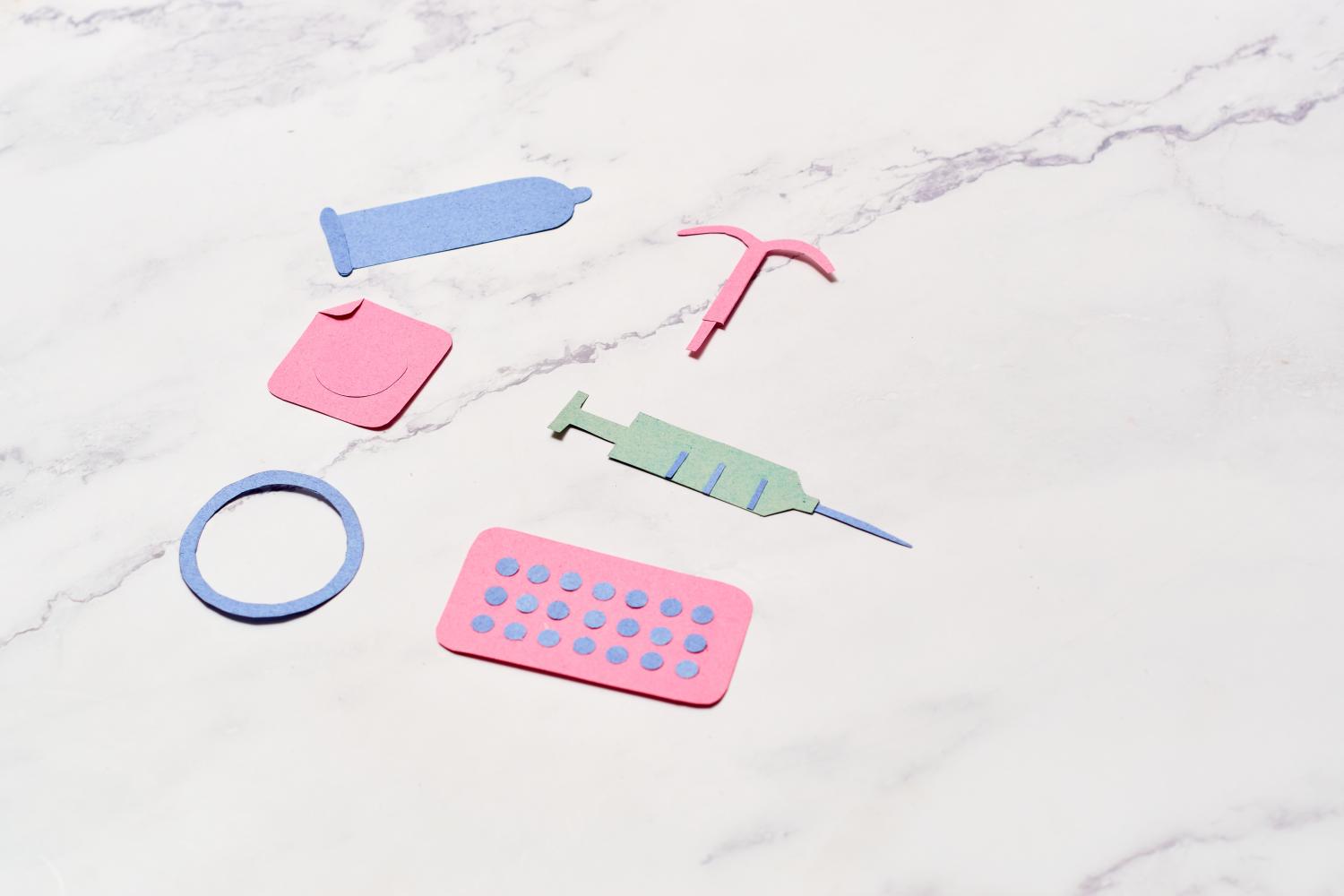 Paper cutouts of different types of contraceptives