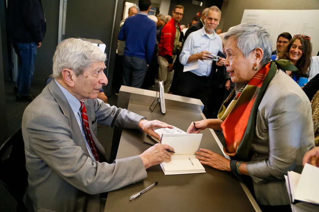 Marvin Kalb signs copies of his book, "Assignment Russia" at a Brookings event. Photo Credit: Paul Morigi