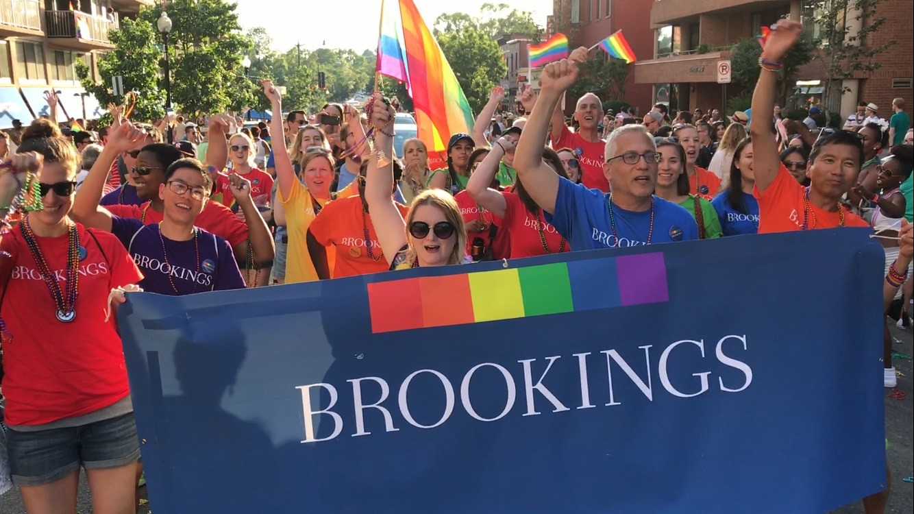 Brookings staff with a pride banner