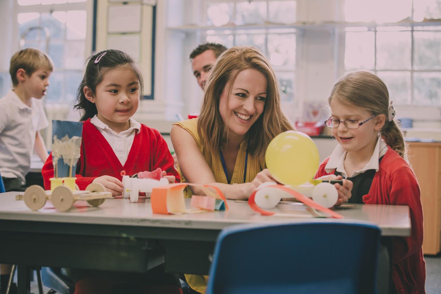 A teacher in Latin America instructs her students on STEM.