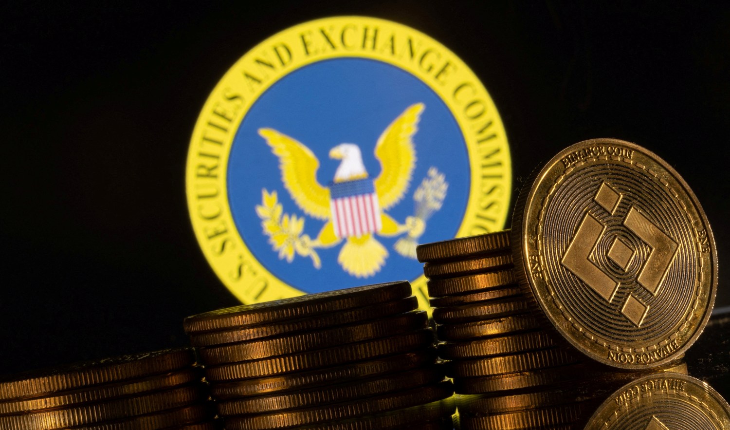 FILE PHOTO: U.S. Securities and Exchange Commission logo and representations of cryptocurrency Binance are seen in this illustration taken June 6, 2023. REUTERS/Dado Ruvic/Illustration/File Photo